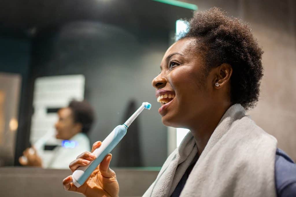 brushing with an electric toothbrush