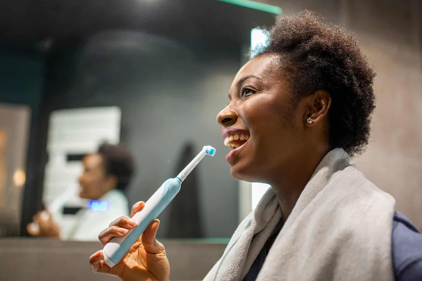 brushing with an electric toothbrush