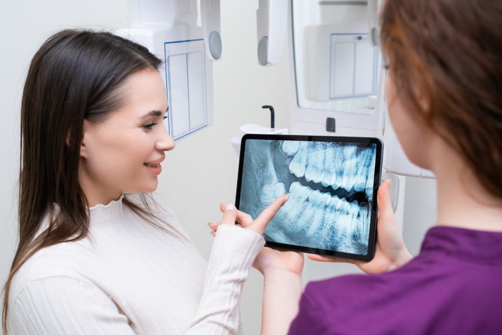 showing dental x-ray on tablet